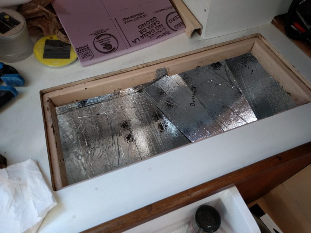 First layer of insulation glued into the box